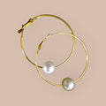 Gold hoop earrings with pearl beads 